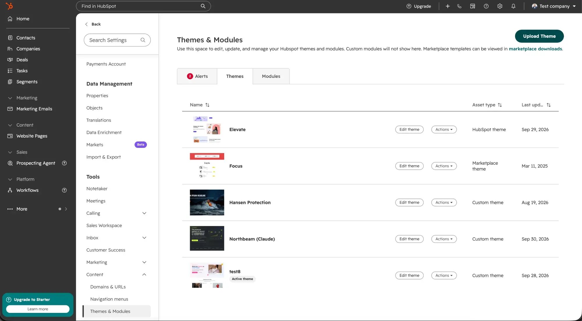 HubSpot Settings, Content, Themes and Modules: the list of themes in the account and the Upload Theme button at the top right
